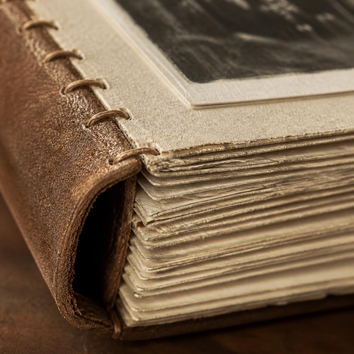 Close up of paper and stitched binding
